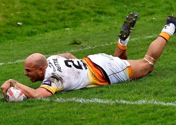 Batley winger Wayne Reittie, pictured scoring a spectacular try against Toronto in which he dislocated his shoulder,  is among five players from the Heavy Woollen District selected in the Jamaica squad for next months Americas Championship and World Cup qualifying games. Picture: Paul Butterfield