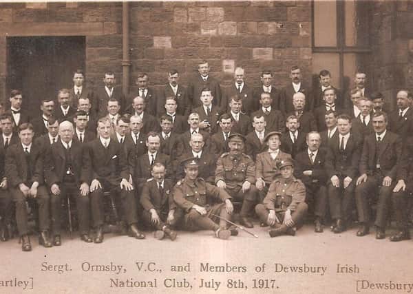 Good friends: Sgt Joe Breheney MM is seated on the left of Sgt John William Ormsby VC, (centre), pictured  with members of Dewsbury Irish National Club in 1917 to mark them being presented with their medals at Buckingham Palace. Sgt Breheney died the following year from influenza.