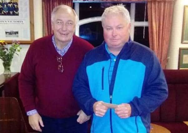 Spen Victoria winter bowls qualifier Chris Mordue presented him with his prize money by Peter Ellis
