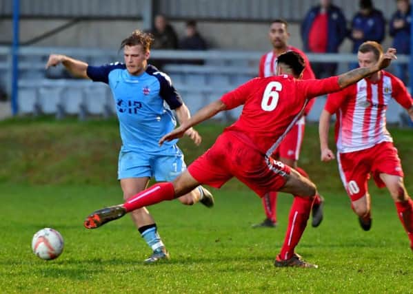 Liversedge's Rhys Davies looks to take on an Eccleshill defender in Saturday's derby.