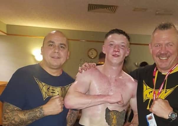KBW boxer Danny Kelly celebrates his points victory over Kamell Case.
