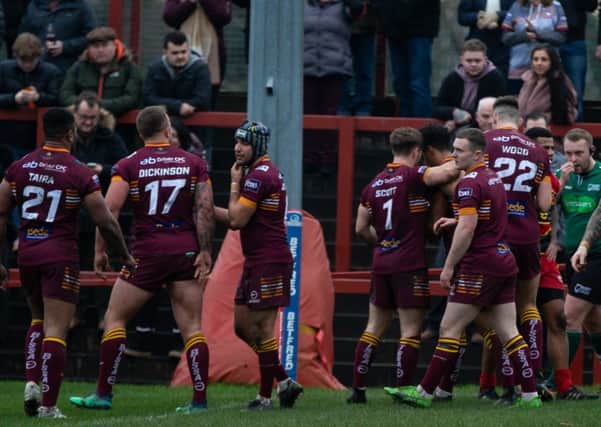 Batley Bulldogs celebrate scoring during the Boxing Day derby against Dewsbury Rams.