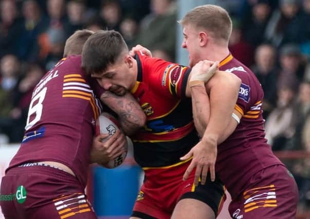 Owen Hargreaves is held up by the Batley Bulldogs defence during yesterdays Boxing Day clash at Mount Pleasant. He came off the bench for his first trial game with Dewsbury Rams. Picture: Bruce Fitzgerald