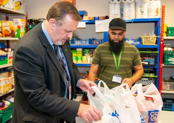 High Praise: Mark Burns-Williamson, West Yorkshires Police and Crime Commissioner, thanked food bank volunteers during his visit.