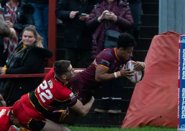 Batley winger Johnny Campbell dives over for the Bulldogs second try during the Boxing Day derby against Dewsbury Rams. Pictures: Bruce Fitzgerald