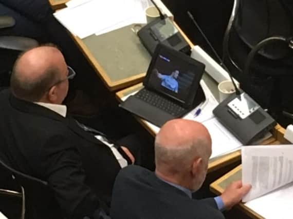 Councillor Steve Hall was caught watching football during a council meeting on Wednesday night.