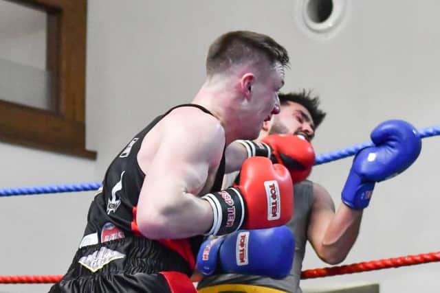 Danny Kelly lands a telling blow against Zahid Din durng his unanimous points win on the KBW Clubs home show last Saturday. Picture Sam Young