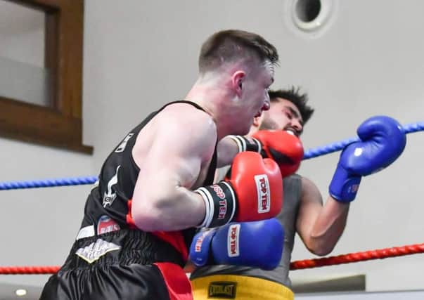 Danny Kelly lands a telling blow against Zahid Din durng his unanimous points win on the KBW Clubs home show last Saturday. Picture Sam Young