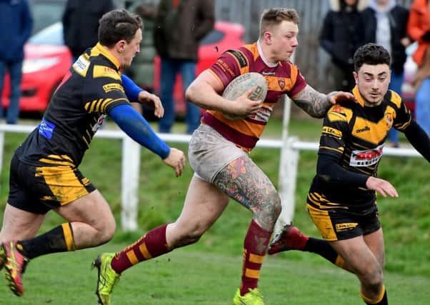 George Croisdale beats the Skirlaugh defence on the way to scoring in Dewsbury Moors Challenge Cup first round win.
