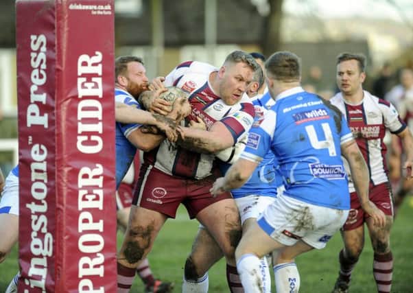 Thornhill's Zach Johnson is tackled by the Rochdale Mayfield defence during his side's Challenge Cup second round defeat last Saturday. Picture: Scott Merrylees