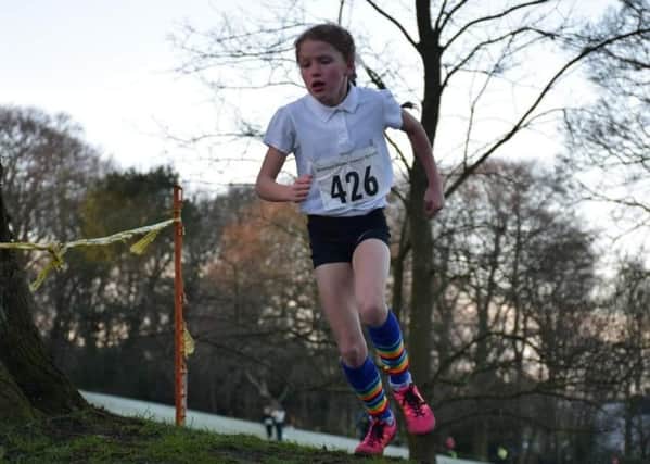 Imogen Atkinson competing at Cross Country