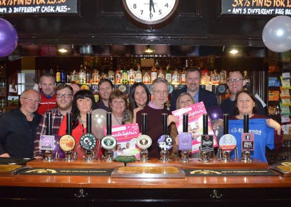 Landmark year: Staff and patrons at Beerhouses get together for a special picture to mark 25 years.