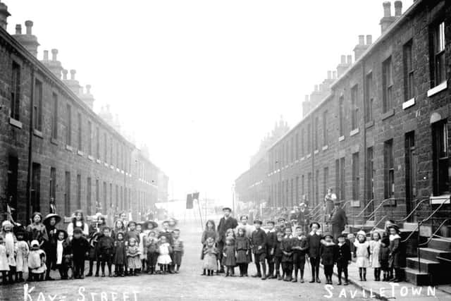 A moment in time: Children pose for a picture in Kaye Street, Savile Town, before part of the street was demolished in the 1960s. Most of the other streets in the area survived demolition.