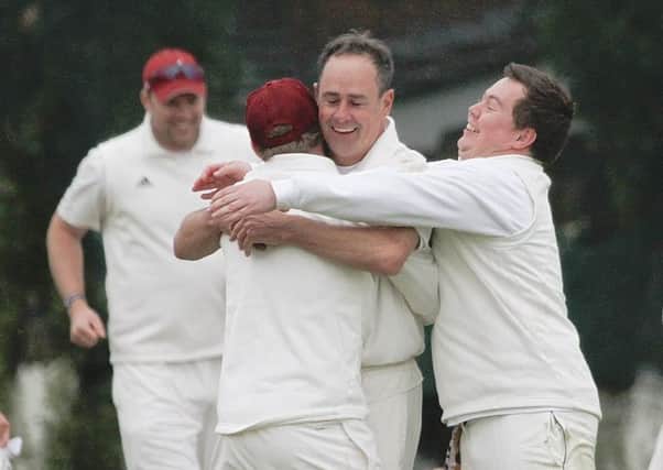 John Carruthers celebrates taking his 1,000th Bradford League wicket against Yeadon in 2015.