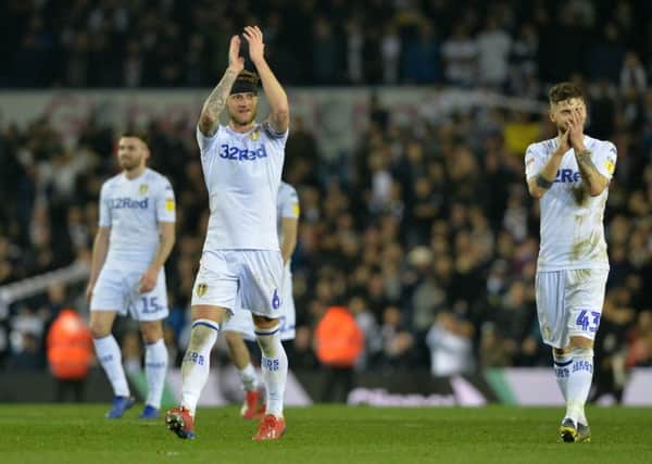 Liam Cooper and Mateusz Klich applaud the Leeds United fans after the West Brom game. Picture: Bruce Rollinson