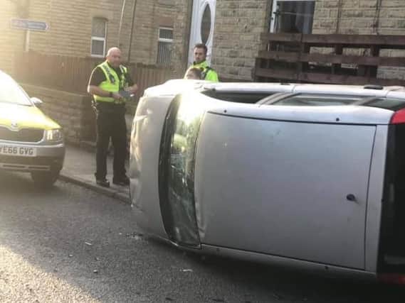 A car has been overturned on Union Road in Heckmondwike. Credit: Nathan Hardcastle