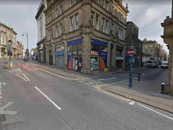 West Yorkshire Police are today appealing for information regarding an armed robbery in Huddersfield last month which took place on Wood Street at the junction with Kirkgate, pictured.