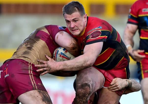 Chris Annakin attempts to break up a tackle by Sheffields Patrick Burns and Corey Makelim as he looks to set up a Dewsbury Rams attack in last Sundays Championship clash at Tetleys Stadium. Picture: Paul Butterfield