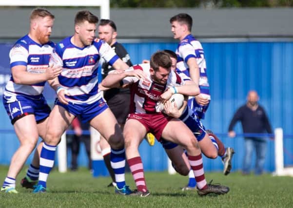 A Thornhill attacker sees his strong run halted during last Saturdays National Conference League Premier Division game at Siddal. Picture: Bruce Fitzgerald