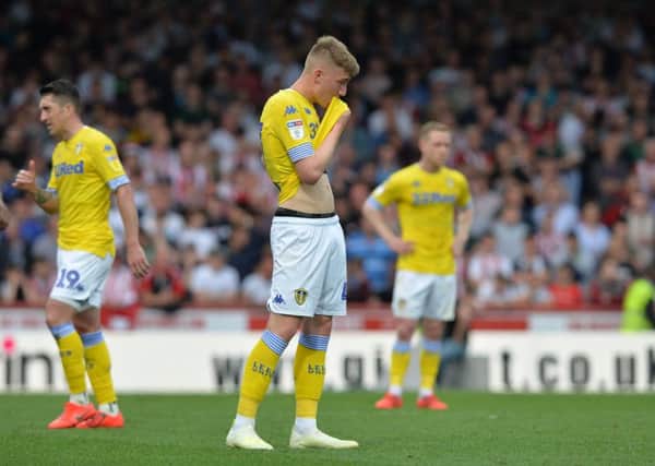 Dejected Jack Clarke and shellshocked Leeds United teammates at full-time at Brentford.
