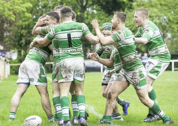 Dewsbury Celtic players celebrate James Walker's try during last Saturday's derby win over Batley Boys.