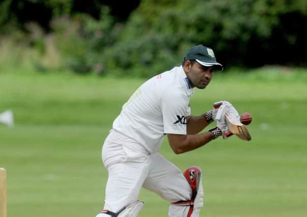Shoukat Ali struck a magnificent 107 not out and claimed 3-10 as Moorlands defeated Scholes to return to the top of the Huddersfield League Premiership. Picture: Steve Riding