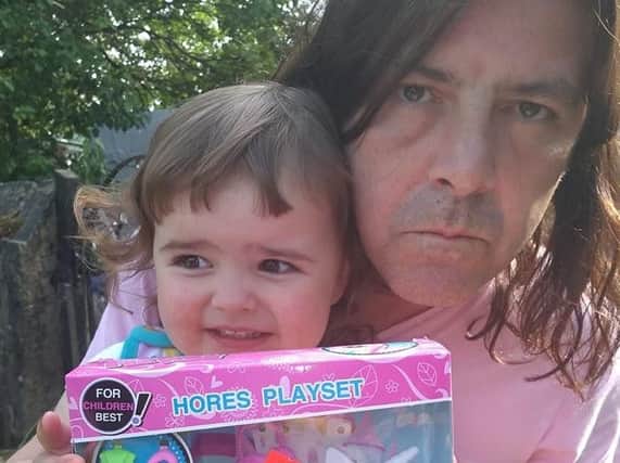Joe with daughter Daisy and the toy set.