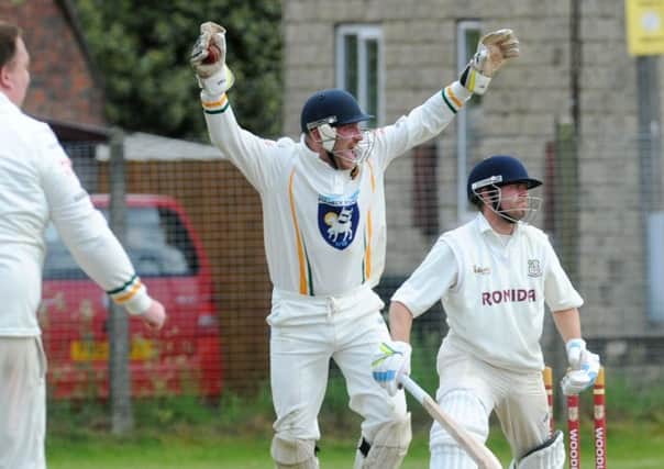 Pudsey St Lawrence wicketkeeper Charlie Best celebrates stumping Woodlands opener Tim Jackson during Saturdays Bradford Premier League clash. Picture: Steve Riding