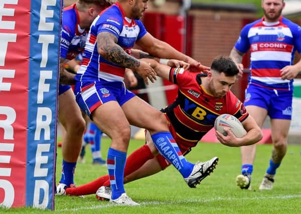 Joe Martin scores during Dewsbury's 66-10 victory over Rochdale Hornets.