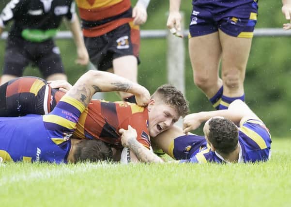Callum Barker burrows over for for a try but it wasn't enough to prevent Shaw Cross slipping to defeat against Dudley Hill. Picture: Allan McKenzie