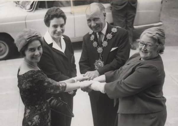 Helping hand: Eileen Fenton is pictured when she was secretary of Dewsbury Swimming Club with one of her star pupils Jean Oldroyd, who took part in the Commonwealth Games in Cardiff in 1958. Also pictured the then Mayor and Mayoress of Dewsbury, Councillor and Mrs Tom Tarney. Picture kindly loaned by Catherine Tarney.