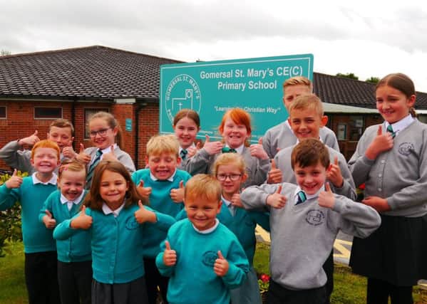 St Marys Primary School pupils give the thumbs-up to the Ofsted report.