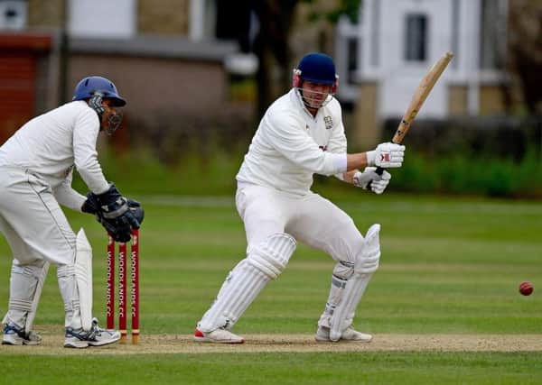 Woodlands captain Cieran Garner hit the winning runs as his side overcame Hanging Heaton to reach a third Priestley Cup final in four years,