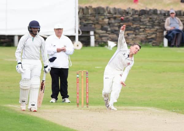 Cleckheaton bowler Alex Midgley in action during the Bradford Premier League game at Lightcliffe last Saturday.
