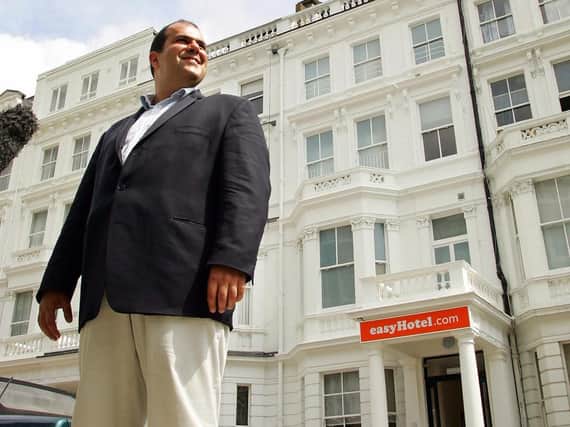 Cypriot billionaire and entrepreneur Stelios Haji-Ioannou outside his latest venture easyHotel in London, "Photo credit should read ADRIAN DENNIS/AFP/Getty Images)