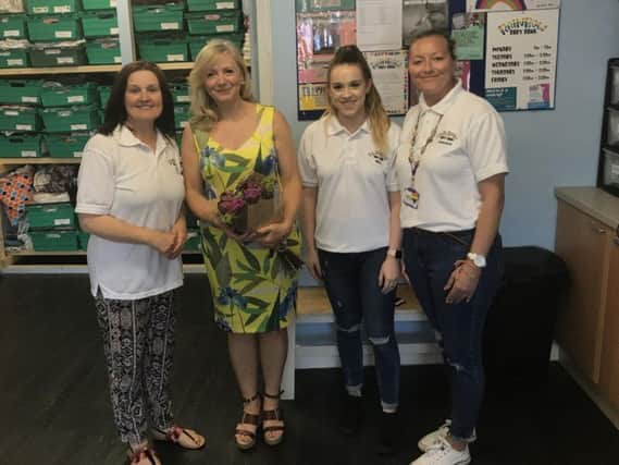 Tracy Brabin with staff from the Rainbow Baby Bank in Heckmondwike