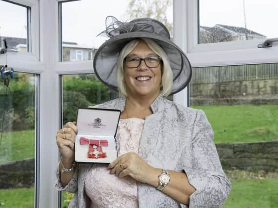 Mrs Evans, 61, of Liversedge, was awarded her MBE for services to Education