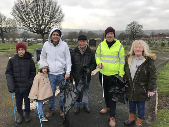 Clean-up:  MP Mark Eastwood with members of the New Friends of Dewsbury Cemetery during the litter-pick.