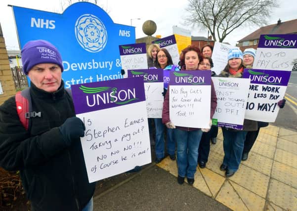 ON STRIKE Unison's Dave Byrom and colleagues on the picket line at Dewsbury and District Hospital. (D515E305)