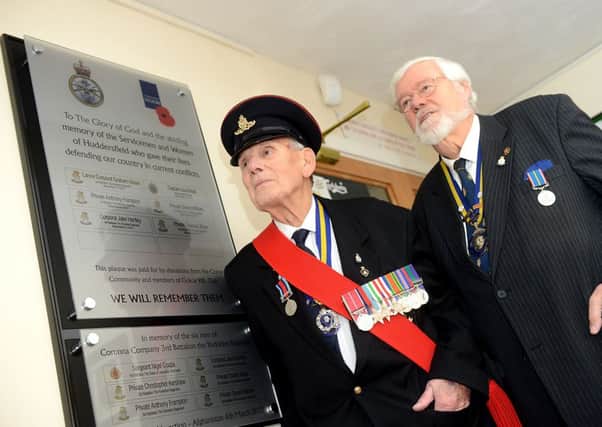 TRIBUTE: Golcar Royal British Legion have erected a plaque in honour of fallen soldiers, including Dewsbury's Cpl. Jake Hartley. Pictured branch president Charles William Landon BEM and county president Robert Mortimer with the new plaque. (d314b306)