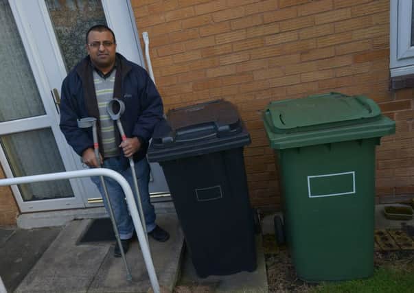 LET DOWN: Saghir Qayum, who suffers from cerebral palsy and was waiting for eight weeks for his bins to be collected.