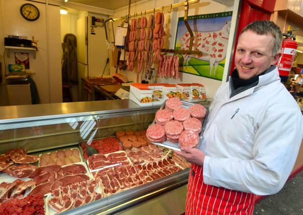 Butcher Neil Wilcock has had a boost in trade at his market stall since the horse meat scandal. (D532A308)