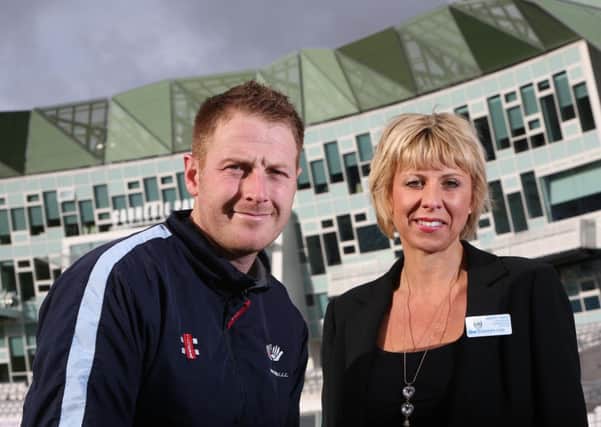 TEAM PLAYER Yorkshire cricket captain Andrew Gale with Huddersfield Town's Mandy Barwick.