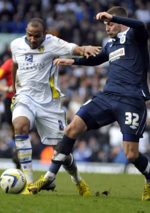 Rodolph Austin takes on Jack Hunt for Leeds United against Huddersfield Town. Picture: IAN HARBER