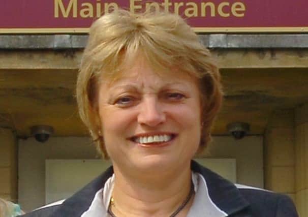 DRAFTED IN Mirfield Free Grammar principal Lorraine Barker is helpnig to oversee things at Colne Valley Specialist Arts College.