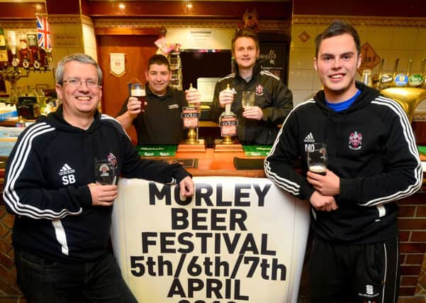 Simon Barraclough and Matthew Dowse (in front of the bar) join Paul Horne (Partners Brewery in Dewsbury) and David Nebard (from Morley Cricket Club) who are partners in organising Morley Beer Festival. (D532E313)