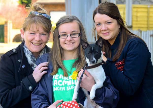 Niamh Reynolds and her dog (shadow) did a sponsored walk for Macmillan Cancer and the Yorkshire Air Ambulance after her cousin died from sudden adult death syndrome and other family members died from cancer. Niamh with Maria Amos from Macmilan and Kerry Garner from YAA (and shadow). (D541B314)