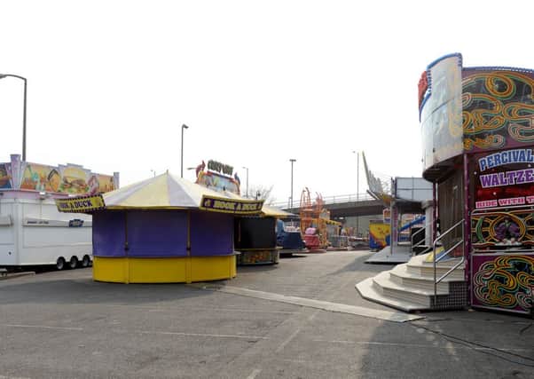 A funfair that has been set up in the car park of Dewsbury Railway Station.