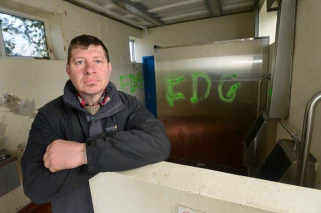 VANDALS STRIKE Coun Andrew White is furious about the graffiti which has been daubed all over Mirfield's public toilets. (D521G316)
