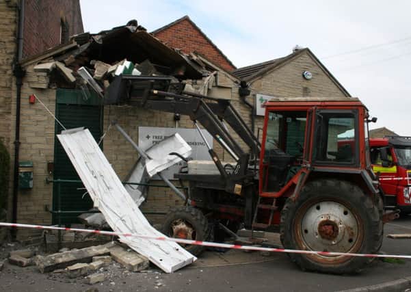 LOST CONTROL A tractor crashed into a Shah's Pharmacy in Valley Road, Liversedge. Picture: Philip Rushworth.